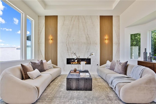 1257 Fetlock Way, Riverside, CA 92506 - living area featuring a high end fireplace and a tray ceiling