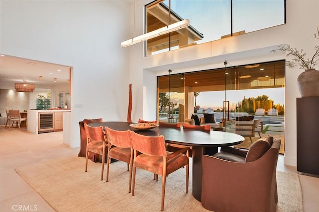 1257 Fetlock Way, Riverside, CA 92506 - dining room with beverage cooler and a towering ceiling