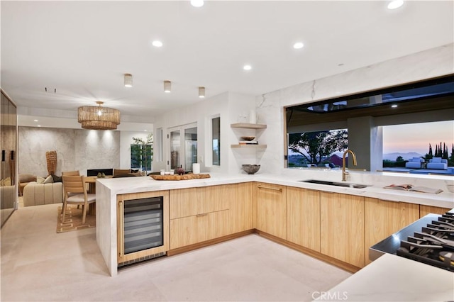 1257 Fetlock Way, Riverside, CA 92506 - kitchen featuring light brown cabinets, beverage cooler, modern cabinets, light countertops, and open floor plan