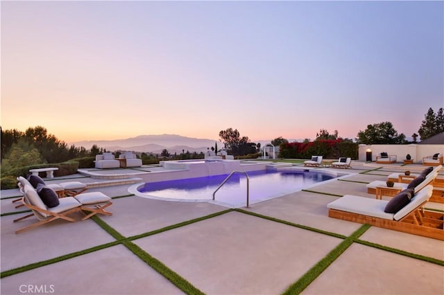1257 Fetlock Way, Riverside, CA 92506 - pool at dusk with a patio and an outdoor pool