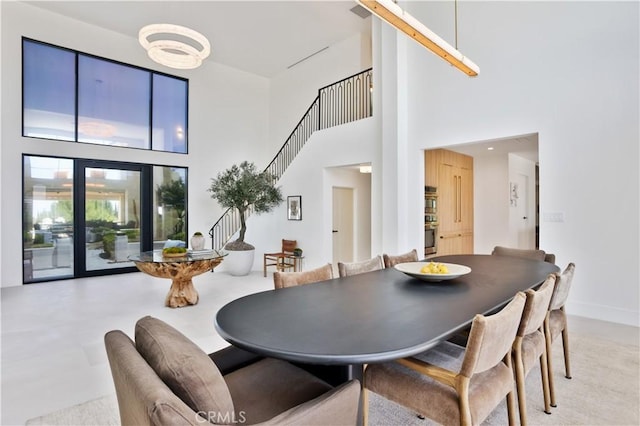 1257 Fetlock Way, Riverside, CA 92506 - dining room with a towering ceiling and stairway