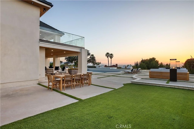 1257 Fetlock Way, Riverside, CA 92506 - yard at dusk with a patio area and a yard