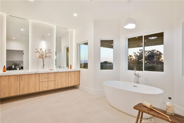 1257 Fetlock Way, Riverside, CA 92506 - full bath featuring double vanity, a freestanding tub, and recessed lighting