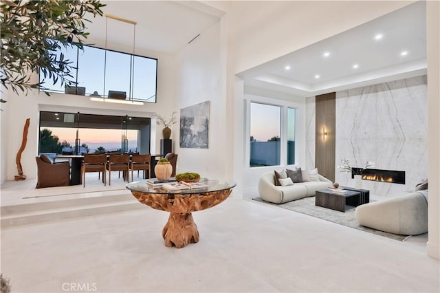 1257 Fetlock Way, Riverside, CA 92506 - living area with recessed lighting, a high end fireplace, a high ceiling, and healthy amount of natural light