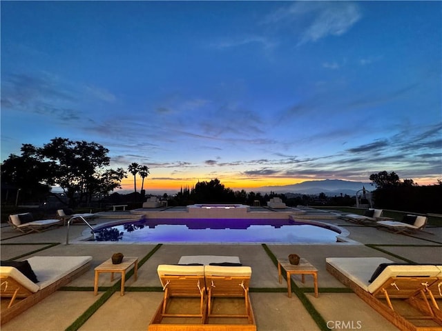 1257 Fetlock Way, Riverside, CA 92506 - pool at dusk with a patio area and an outdoor pool
