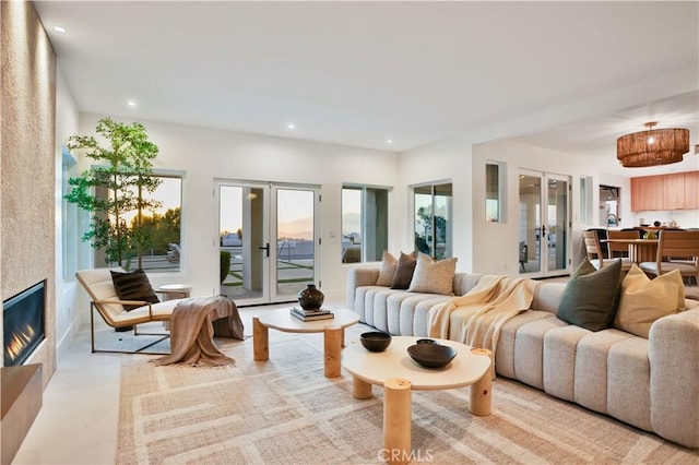 1257 Fetlock Way, Riverside, CA 92506 - living room with french doors, recessed lighting, and a large fireplace