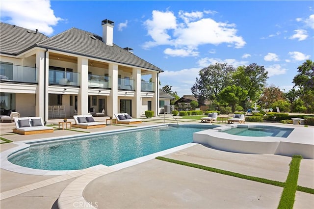 1257 Fetlock Way, Riverside, CA 92506 - view of swimming pool featuring an outdoor living space, a patio, and a pool with connected hot tub