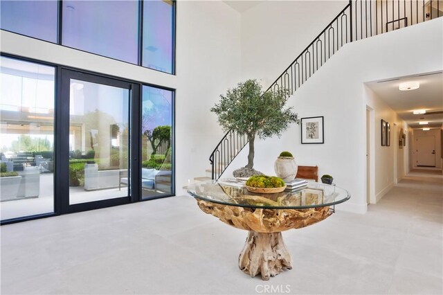 1257 Fetlock Way, Riverside, CA 92506 - carpeted foyer featuring a towering ceiling, stairway, and plenty of natural light