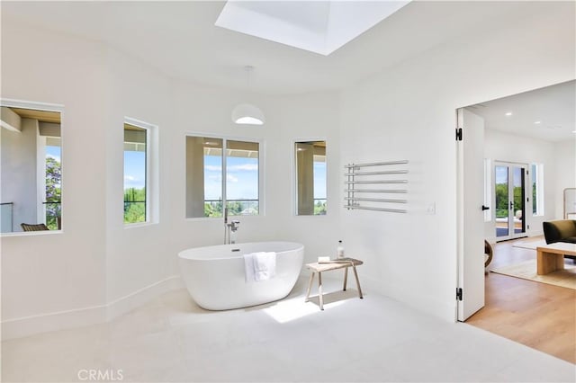 1257 Fetlock Way, Riverside, CA 92506 - full bathroom featuring a freestanding tub, a skylight, and tile patterned flooring