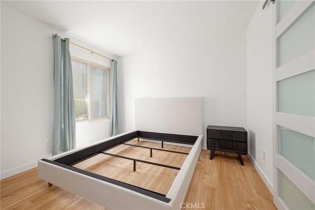 5910 Rancho Mission Rd Unit 27, San Diego, CA 92108 - unfurnished bedroom featuring wood finished floors
