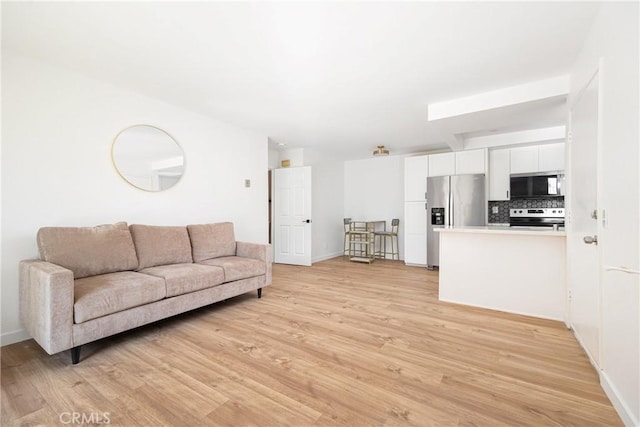 5910 Rancho Mission Rd Unit 27, San Diego, CA 92108 - living room featuring light wood-style floors