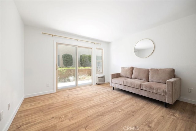 5910 Rancho Mission Rd Unit 27, San Diego, CA 92108 - living room featuring wood finished floors and a wall mounted air conditioner