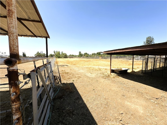 7519 Man O War St, Bakersfield, CA 93307 - view of yard featuring an exterior structure, an outdoor structure, and a rural view