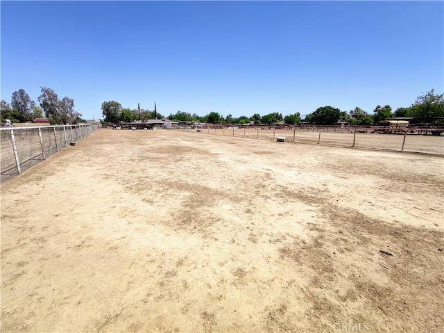 7519 Man O War St, Bakersfield, CA 93307 - view of yard with an enclosed riding area and a rural view