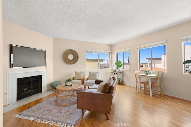 330 34th Pl, Manhattan Beach, CA 90266 - living area featuring wood finished floors, a textured ceiling, and a fireplace
