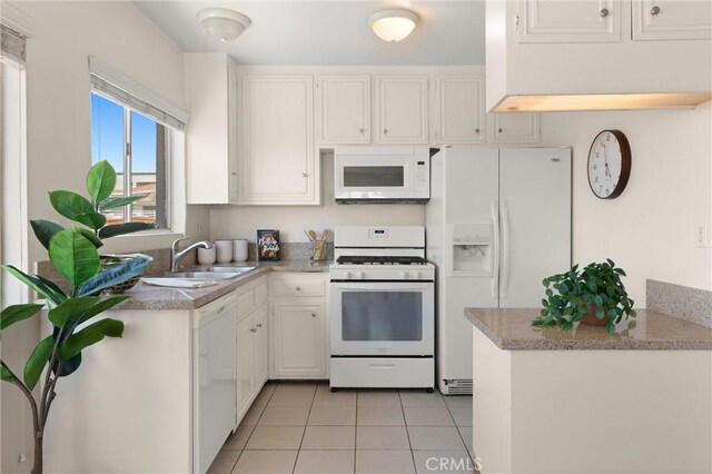 330 34th Pl, Manhattan Beach, CA 90266 - kitchen with white appliances, light tile patterned flooring, white cabinetry, and light countertops
