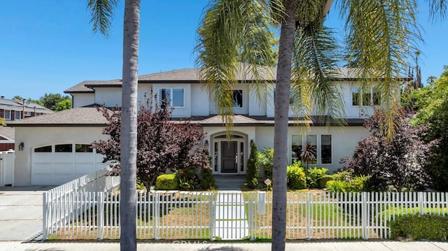 15460 La Maida St, Sherman Oaks, CA 91403 - traditional home featuring stucco siding, an attached garage, driveway, and a fenced front yard