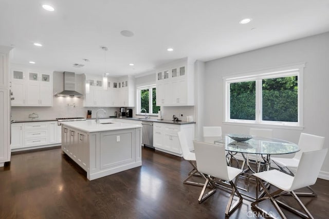 15460 La Maida St, Sherman Oaks, CA 91403 - kitchen with wall chimney range hood, decorative backsplash, dark wood-style flooring, glass insert cabinets, and recessed lighting
