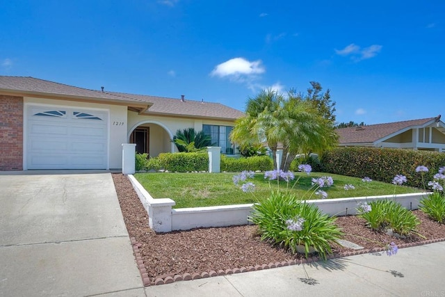 1219 Paseo Hermosa, Oceanside, CA 92056 - ranch-style home with concrete driveway, a front yard, an attached garage, and stucco siding