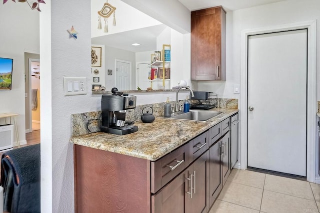1219 Paseo Hermosa, Oceanside, CA 92056 - kitchen featuring light tile patterned floors and light stone counters