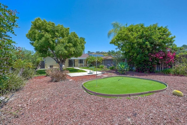 1219 Paseo Hermosa, Oceanside, CA 92056 - view of yard with an area to practice putting and a patio area