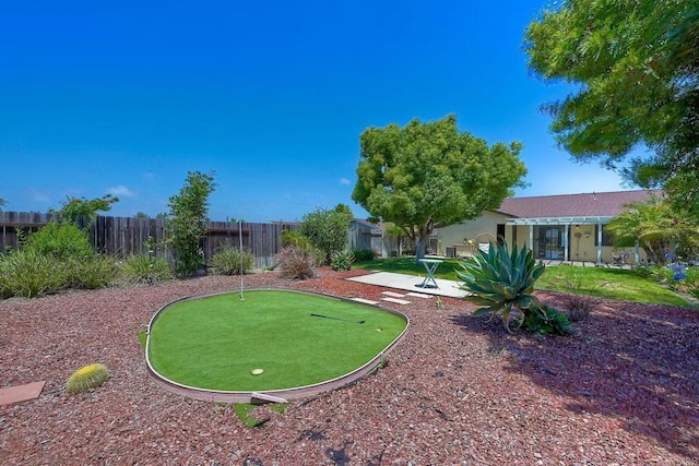 1219 Paseo Hermosa, Oceanside, CA 92056 - view of yard with an area to practice putting, a patio area, and a pergola