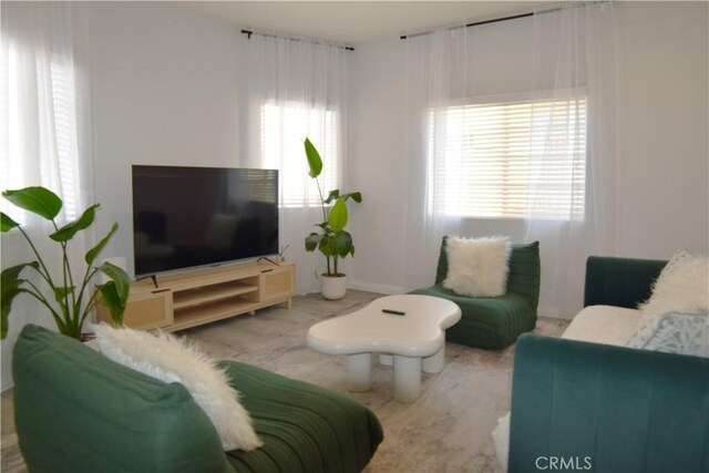 2746 W 14th St, Los Angeles, CA 90006 - living room featuring baseboards