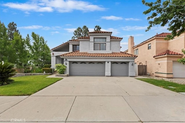 10151 Saddlehill Ter, Rancho Cucamonga, CA 91737 - mediterranean / spanish-style house featuring driveway, stucco siding, an attached garage, and a tile roof