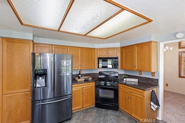 10151 Saddlehill Ter, Rancho Cucamonga, CA 91737 - kitchen featuring black appliances and brown cabinetry