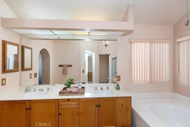 10151 Saddlehill Ter, Rancho Cucamonga, CA 91737 - bathroom featuring double vanity and a garden tub