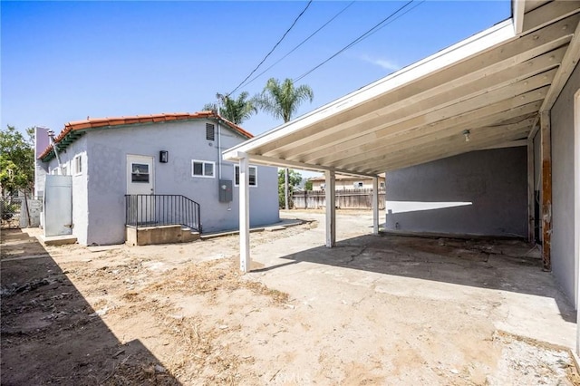 1163 W 3rd St, Pomona, CA 91766 - back of property with stucco siding and a tile roof