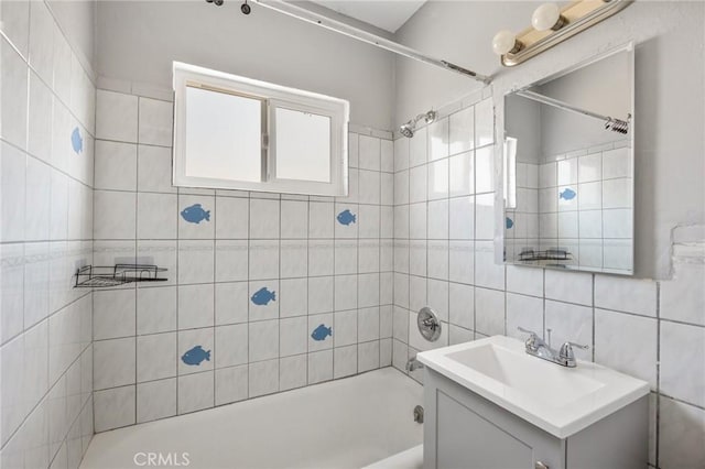 1163 W 3rd St, Pomona, CA 91766 - full bathroom with vanity, washtub / shower combination, and tile walls