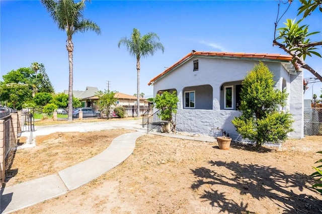 1163 W 3rd St, Pomona, CA 91766 - mediterranean / spanish house with stucco siding