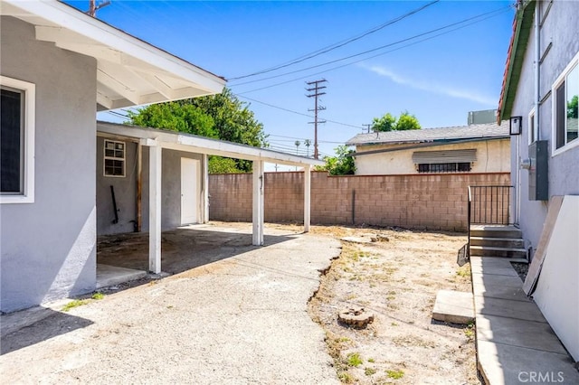 1163 W 3rd St, Pomona, CA 91766 - view of patio / terrace with driveway and a carport