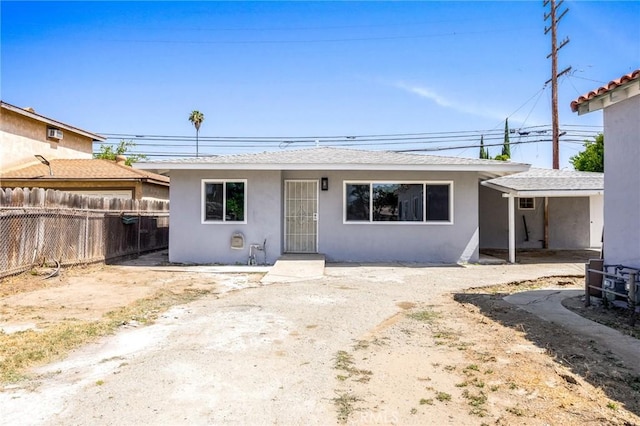 1163 W 3rd St, Pomona, CA 91766 - view of front of house with stucco siding and roof with shingles