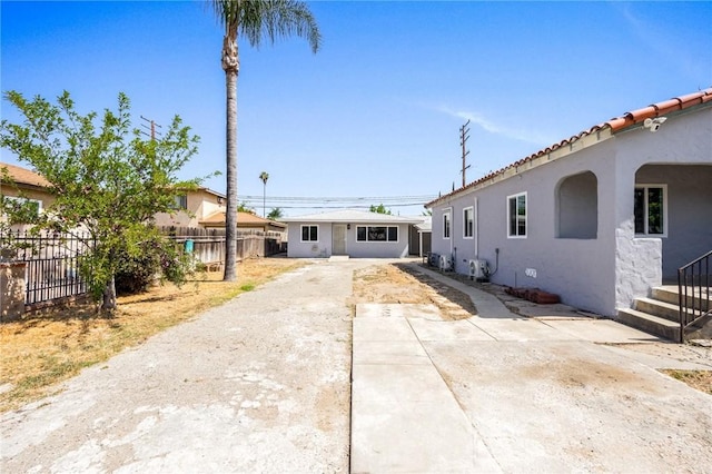 1163 W 3rd St, Pomona, CA 91766 - view of front of house featuring stucco siding and a patio area