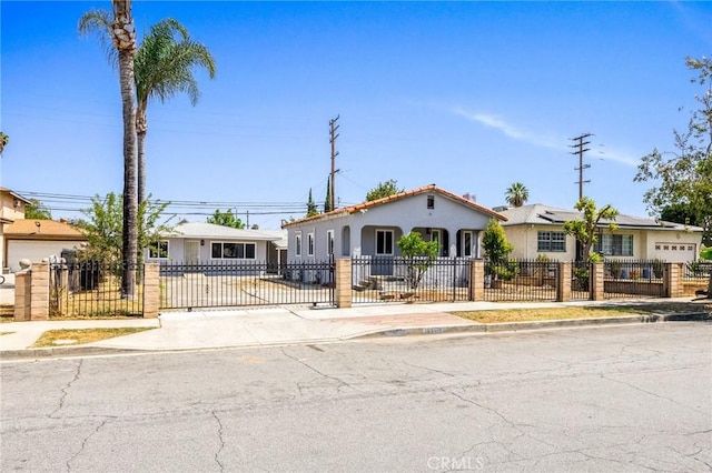 1163 W 3rd St, Pomona, CA 91766 - view of front of home with a fenced front yard and stucco siding