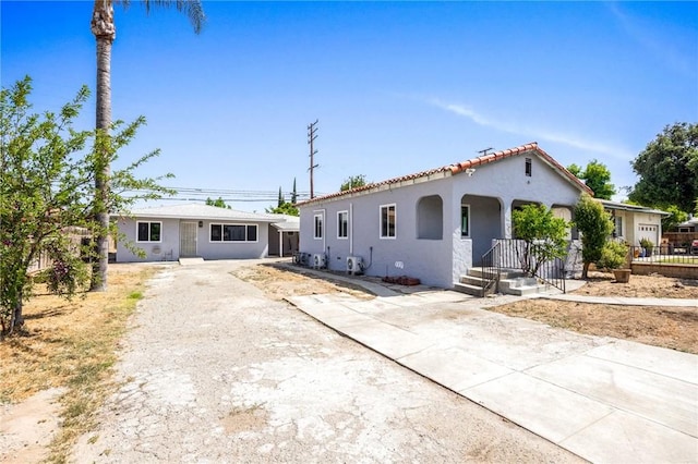 1163 W 3rd St, Pomona, CA 91766 - mediterranean / spanish-style home with driveway and stucco siding