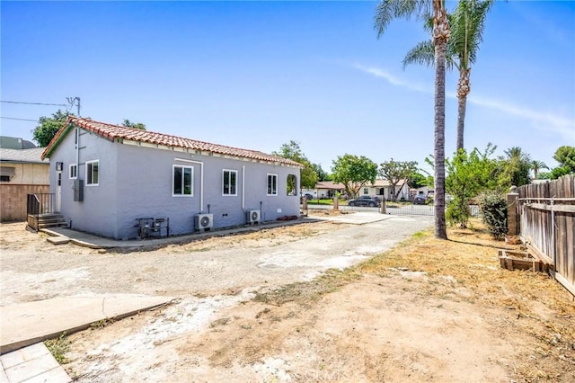 1163 W 3rd St, Pomona, CA 91766 - view of home's exterior with stucco siding and a tiled roof