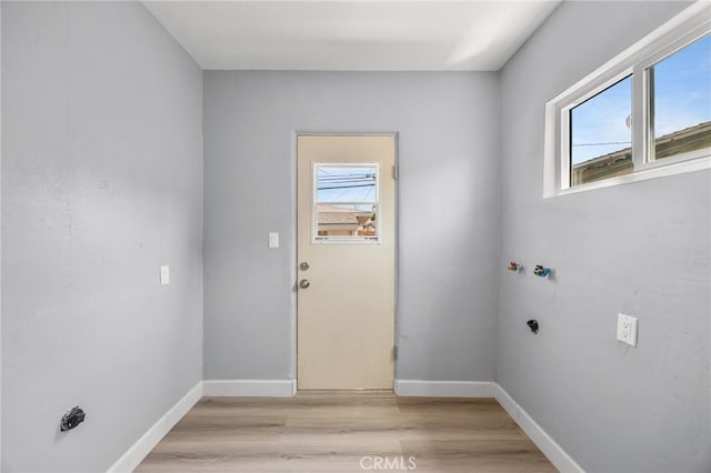 1163 W 3rd St, Pomona, CA 91766 - laundry room with healthy amount of natural light and light wood finished floors