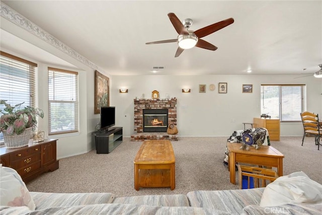 21276 White Pine Dr, Tehachapi, CA 93561 - living area featuring a ceiling fan, carpet flooring, healthy amount of natural light, and a brick fireplace