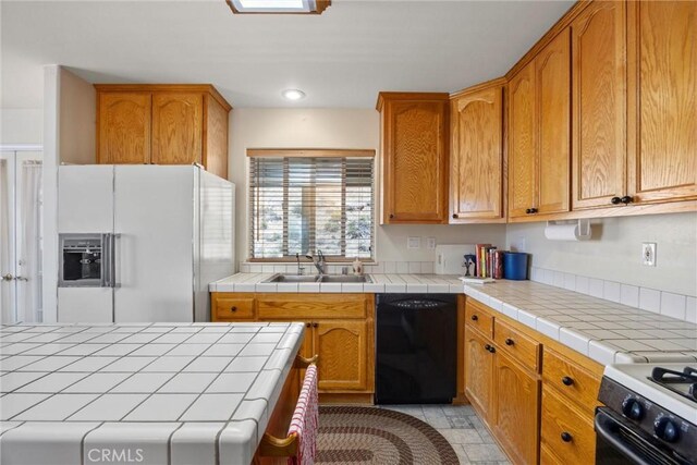 21276 White Pine Dr, Tehachapi, CA 93561 - kitchen featuring black dishwasher, white fridge with ice dispenser, range with electric stovetop, tile countertops, and brown cabinetry