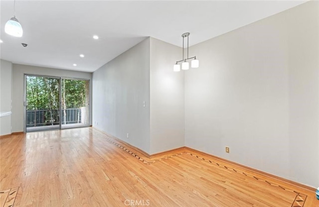 4705 Kester Ave Unit 209, Sherman Oaks, CA 91403 - unfurnished room with wood finished floors and recessed lighting