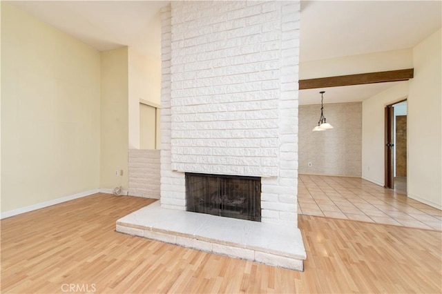 24 Queens Wreath Way, Irvine, CA 92612 - unfurnished living room featuring a fireplace and wood finished floors