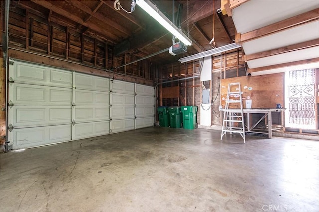24 Queens Wreath Way, Irvine, CA 92612 - garage with a garage door opener and a workshop area