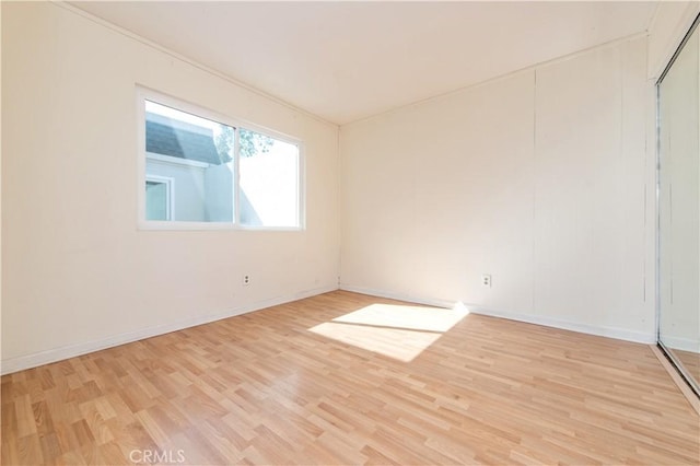 24 Queens Wreath Way, Irvine, CA 92612 - spare room with light wood-style flooring and baseboards