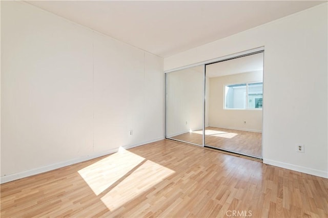 24 Queens Wreath Way, Irvine, CA 92612 - unfurnished bedroom featuring light wood-type flooring and a closet