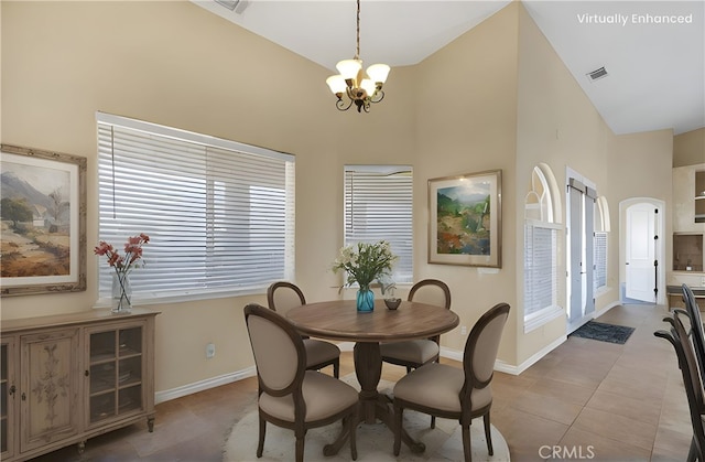 21777 Poppy Rd, Apple Valley, CA 92308 - tiled dining space featuring a chandelier, plenty of natural light, and a towering ceiling