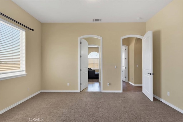 21777 Poppy Rd, Apple Valley, CA 92308 - unfurnished bedroom featuring carpet and arched walkways