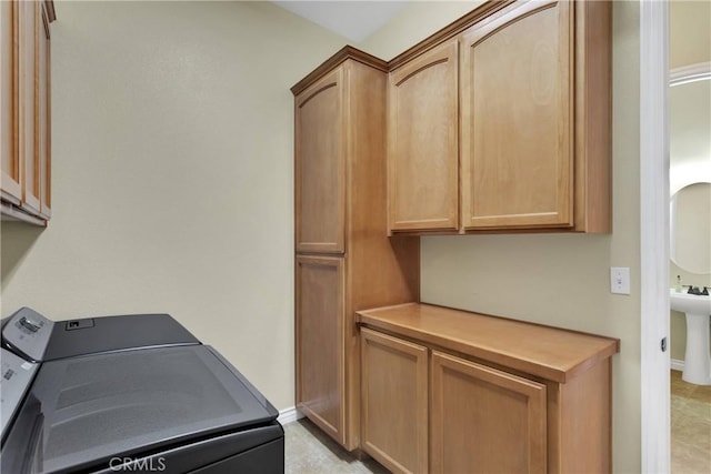 21777 Poppy Rd, Apple Valley, CA 92308 - laundry area featuring cabinet space and independent washer and dryer